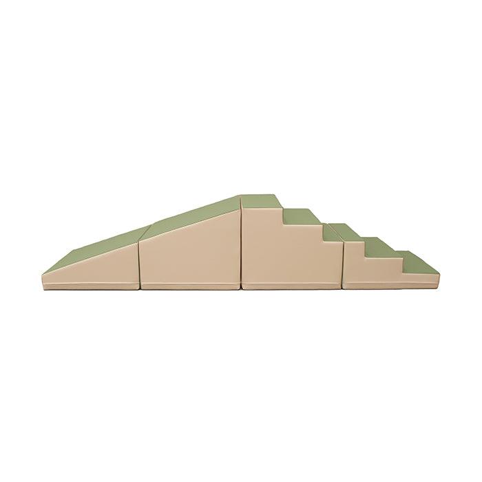An IGLU Soft Play 4 Piece Soft Play Step and Slide Set - Transformer featuring a stack of green and beige blocks, promoting imaginative play and gross motor skill development.