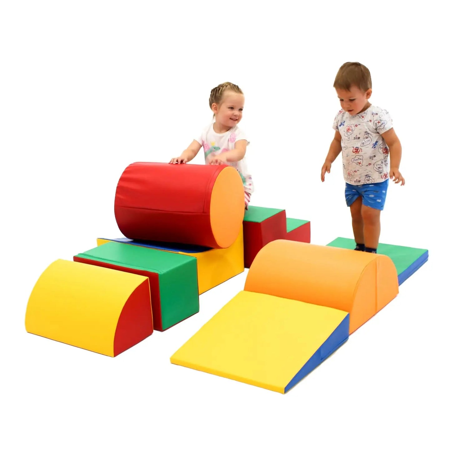 Two energetic toddlers having fun with multicolored soft play blocks. One of them is rolling a cylinder-shaped piece