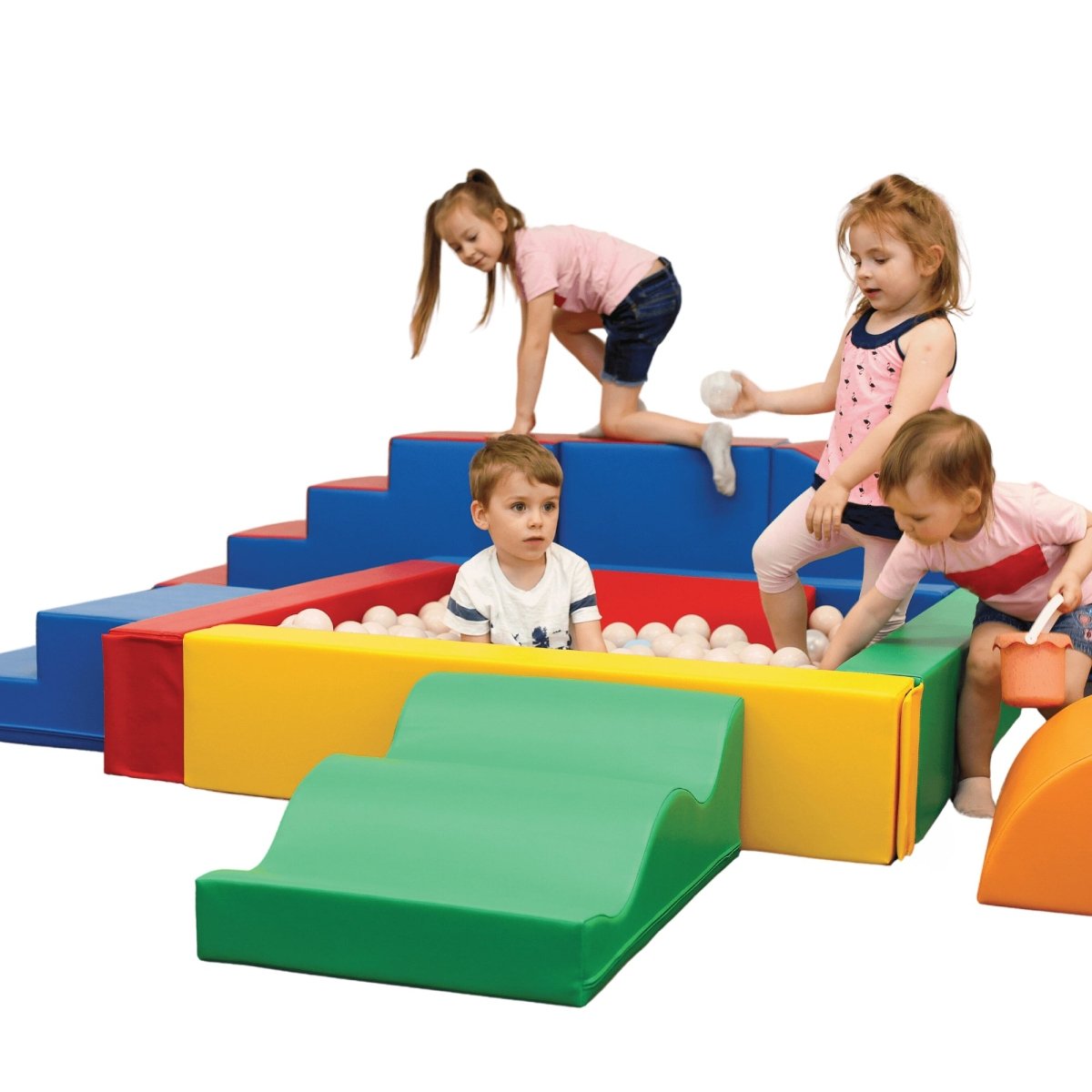 Colorful foam play set with various shapes and a ball pit filled with colorful balls. Happy toddlers climbing and playing