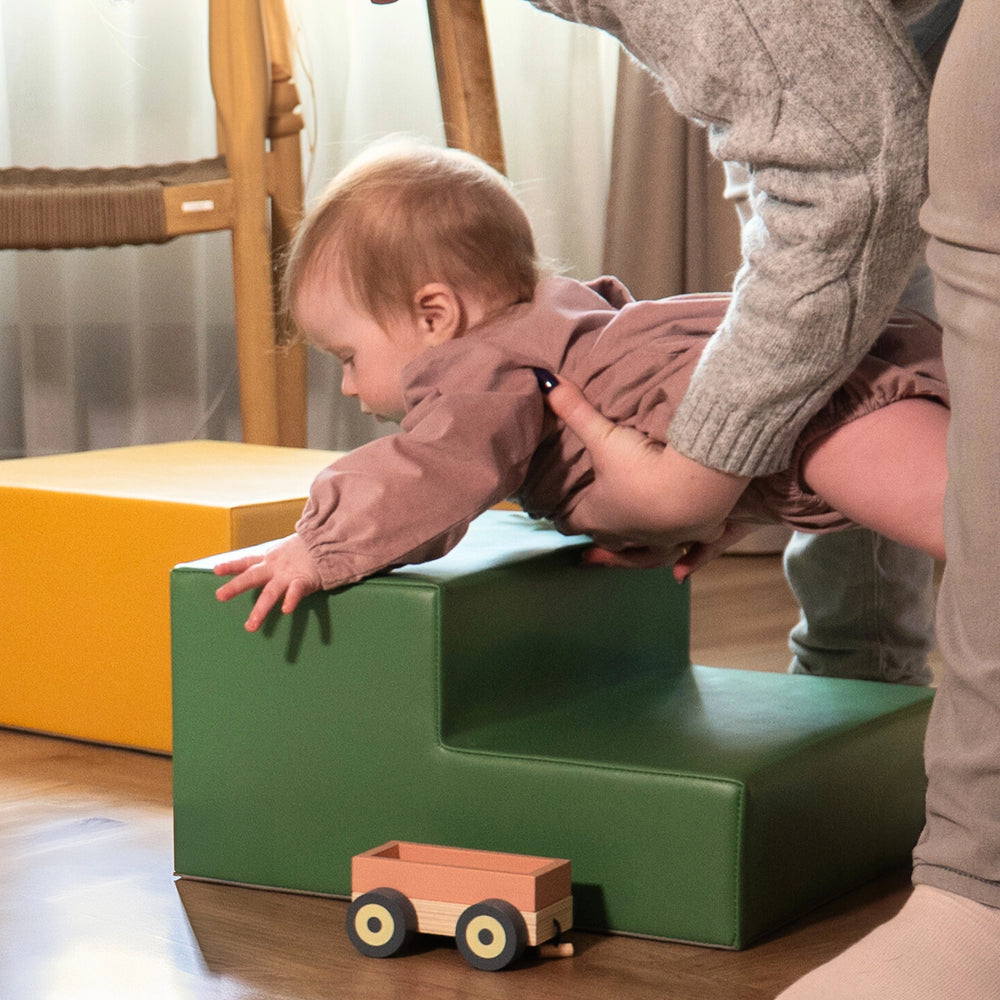 Toddler using a climber for active movement