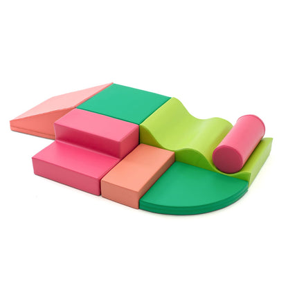 Pink and green soft play set arranged by various shapes, including wedges, steps, squares, and more