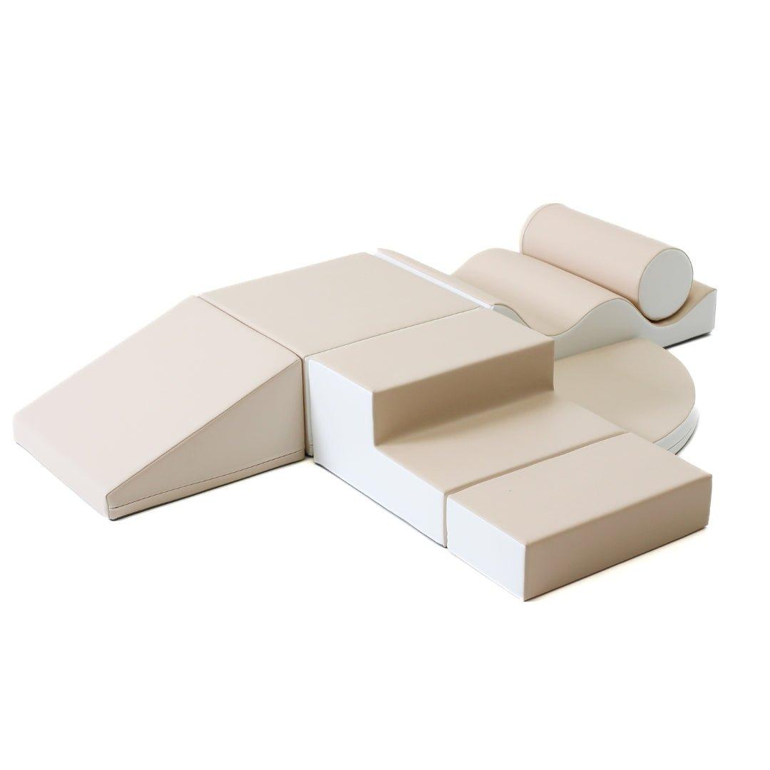 Beige soft play set arranged by various shapes, including wedges, steps, squares, and more