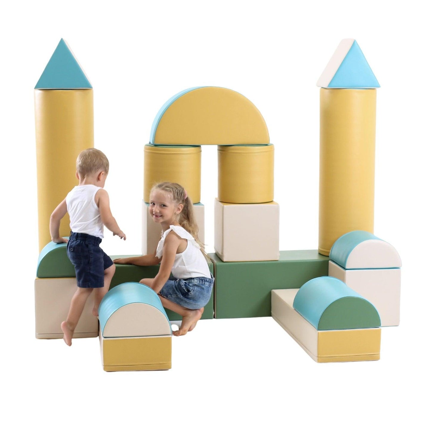 Two kids climbing on a large, light pastel soft play castle arranged from various shapes, like towers, squares, cylinders