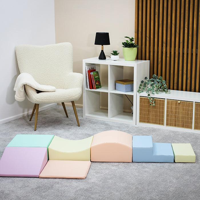 A Soft Play Set - Little Crawler featuring a room full of colorful foam blocks and a chair by IGLU Soft Play.