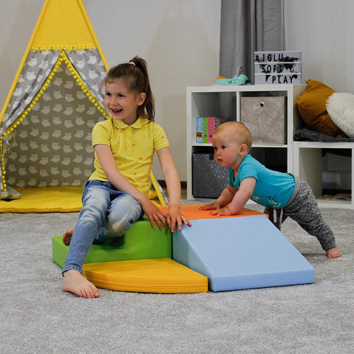 A girl and a boy playing on IGLU soft play set