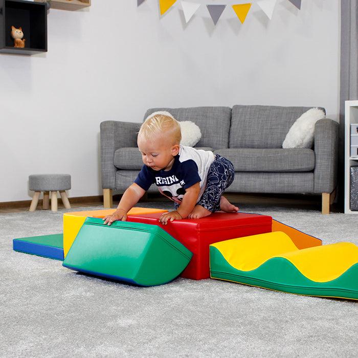 A baby is playing on an IGLU Soft Play Soft Play Activity Set - Discoverer.