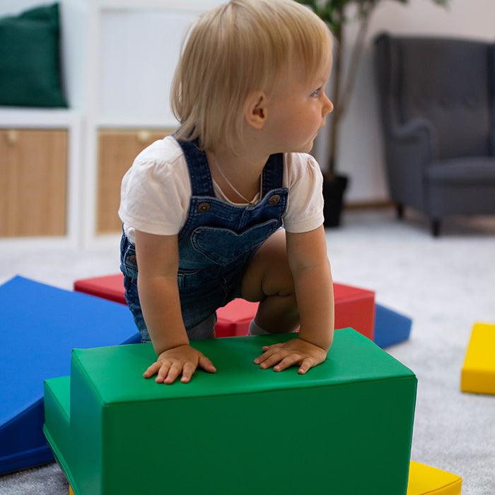 A child is crawling in a room with the IGLU Soft Play - Two Way Crawler.