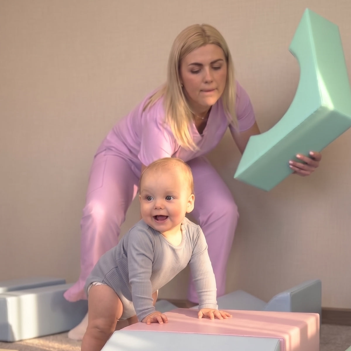 Baby crawling on an IGLU soft play set in a living room